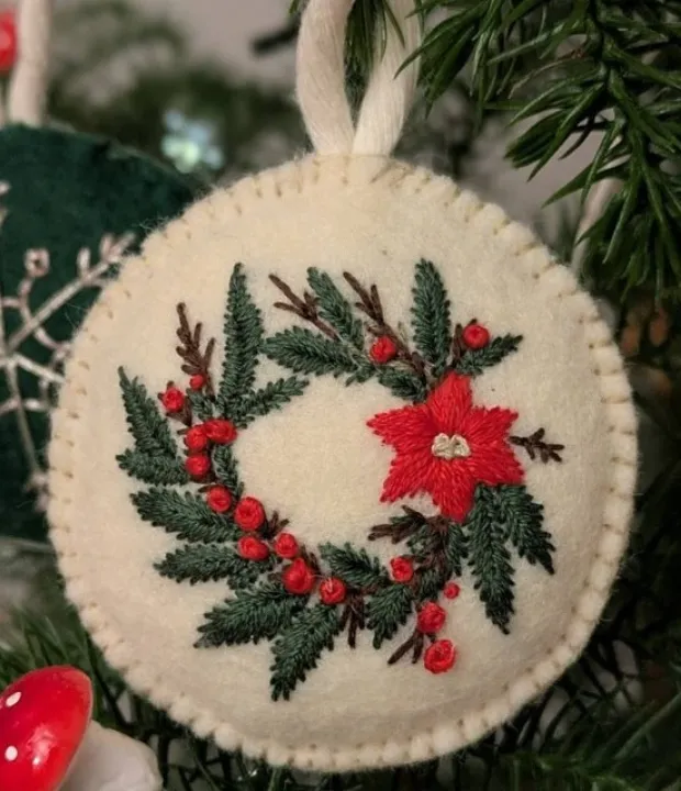 Customer embroidered Christmas wreath ornament with poinsettia