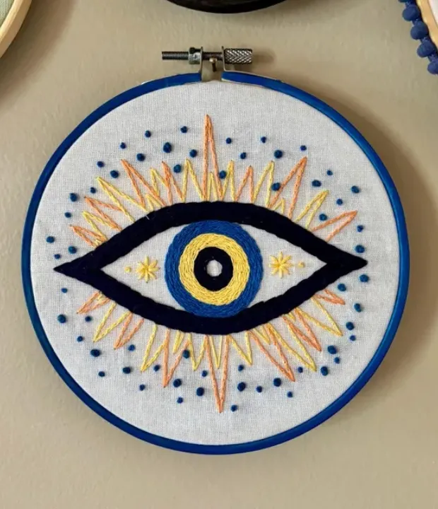 Customer embroidered blue evil eye design in hoop