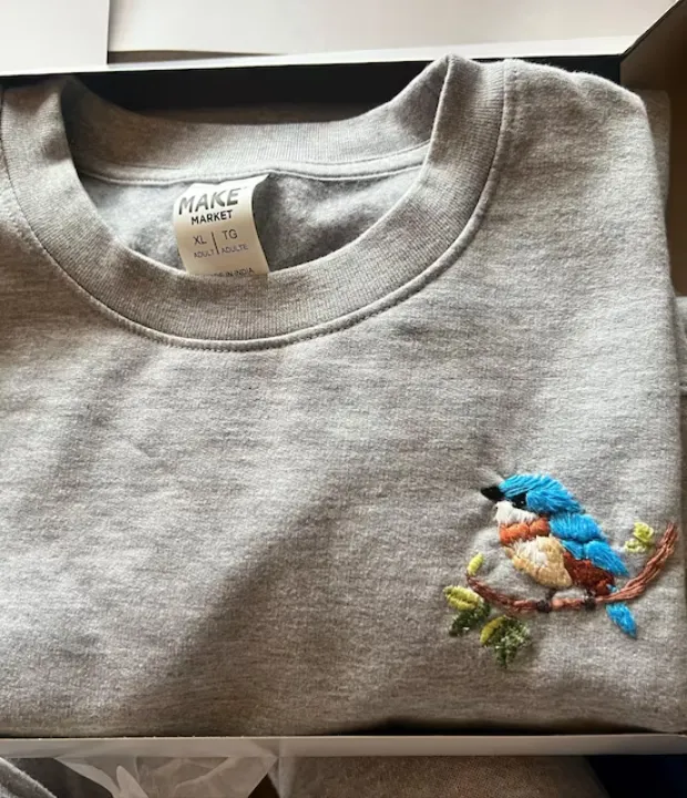 Customer embroidered kingfisher on gray sweatshirt